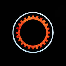 Load image into Gallery viewer, Black sticker with orange sigil of mechanics and engineers
